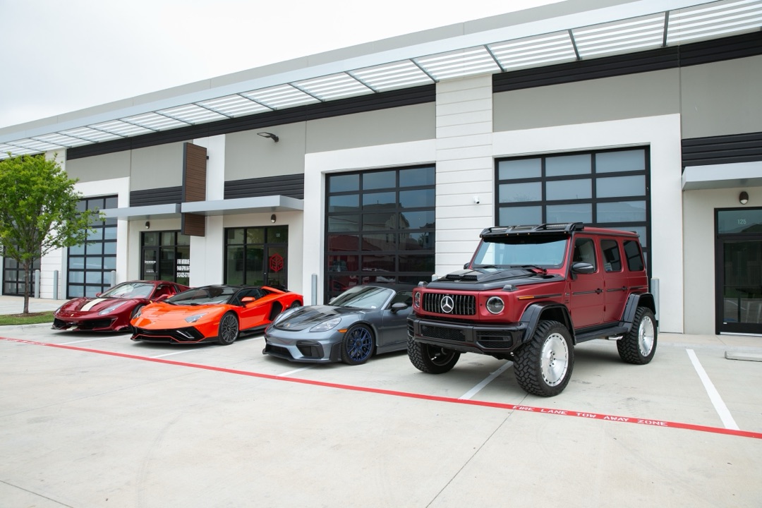 Client vehicles lined up outside Red Box Motors, Austin TX