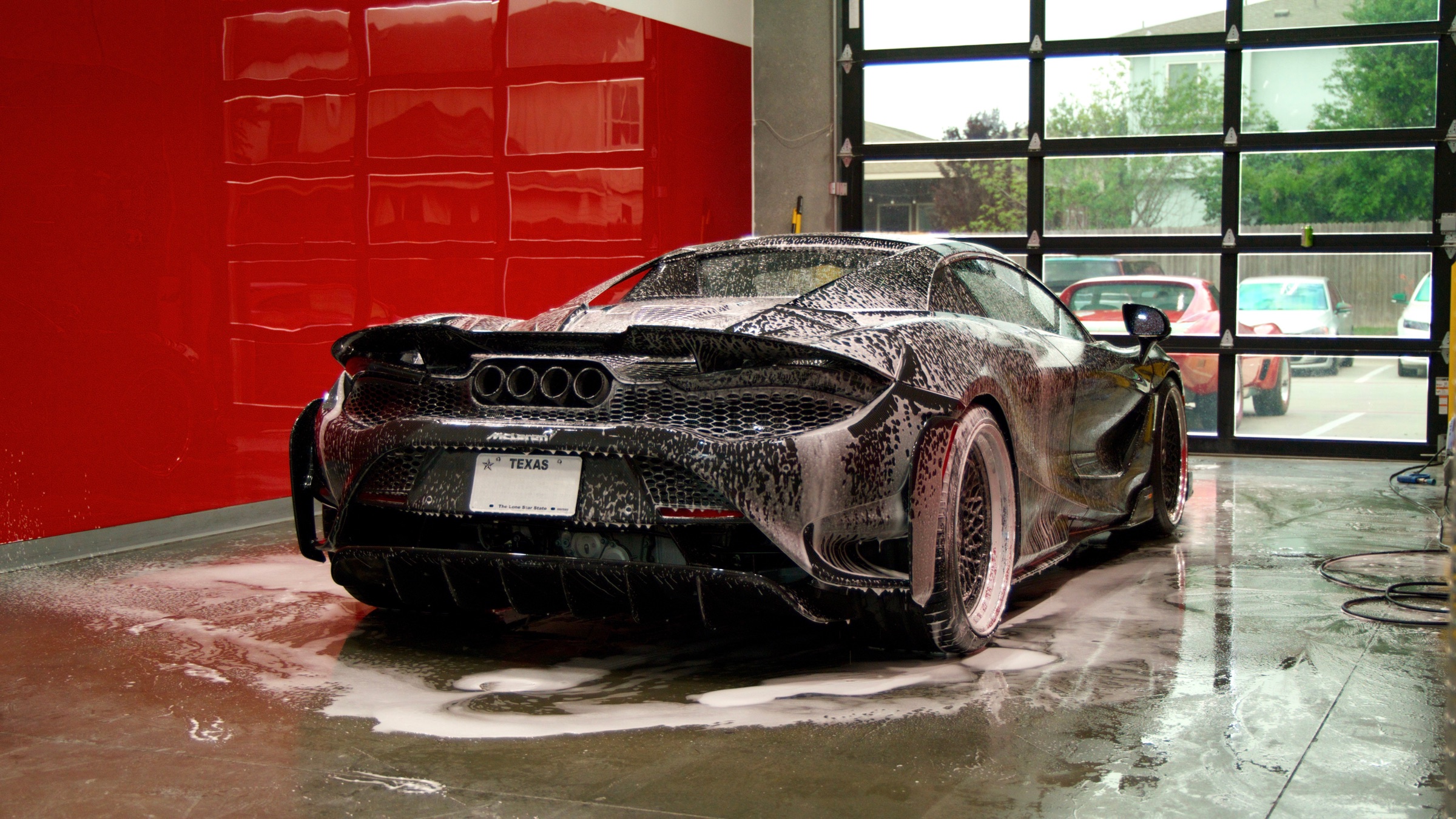 McLaren 765LT in the Red Box Restoration wash bay, Austin TX