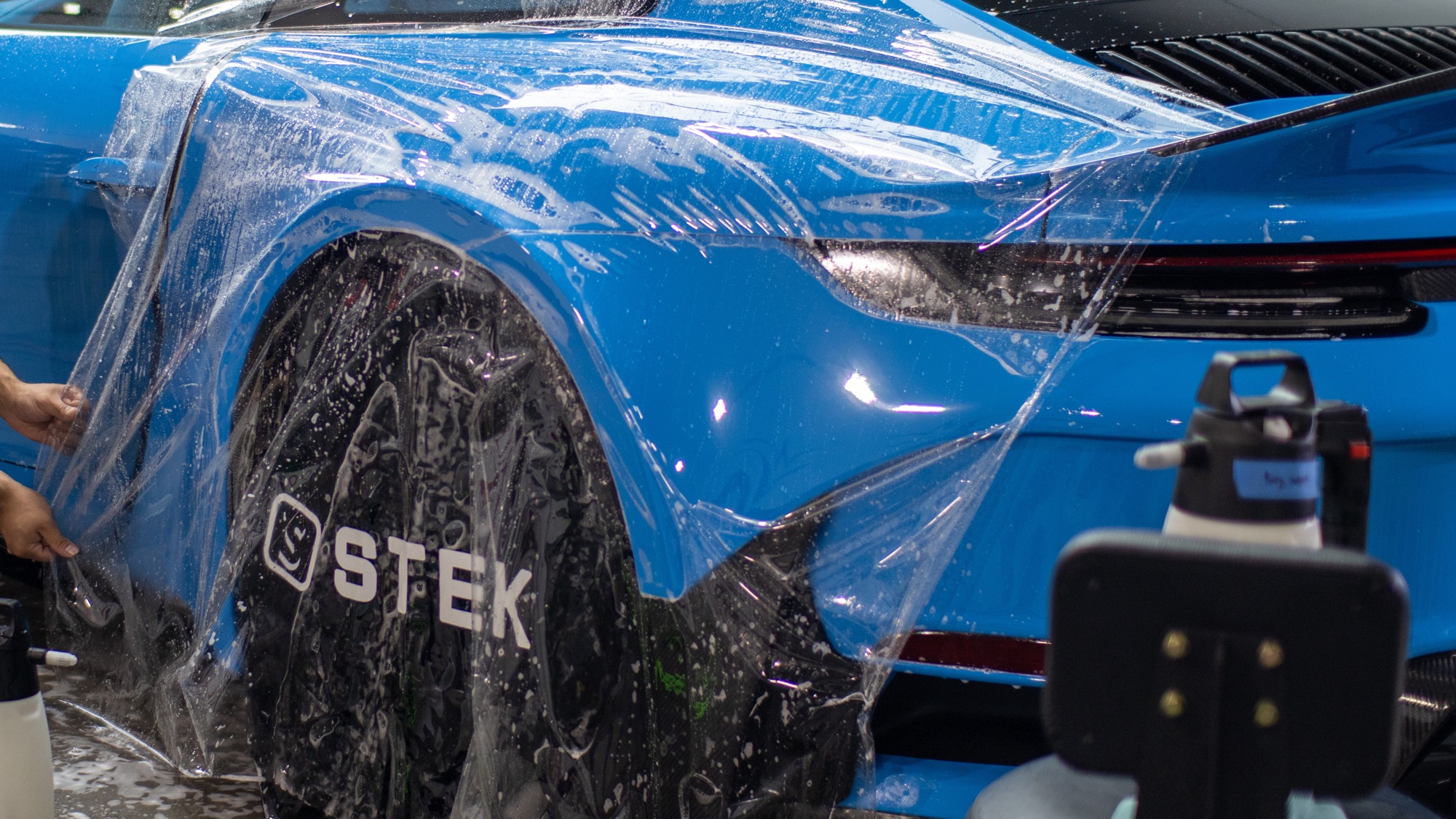 STEK paint protection film installed on a Porsche 911 at Red Box Restoration