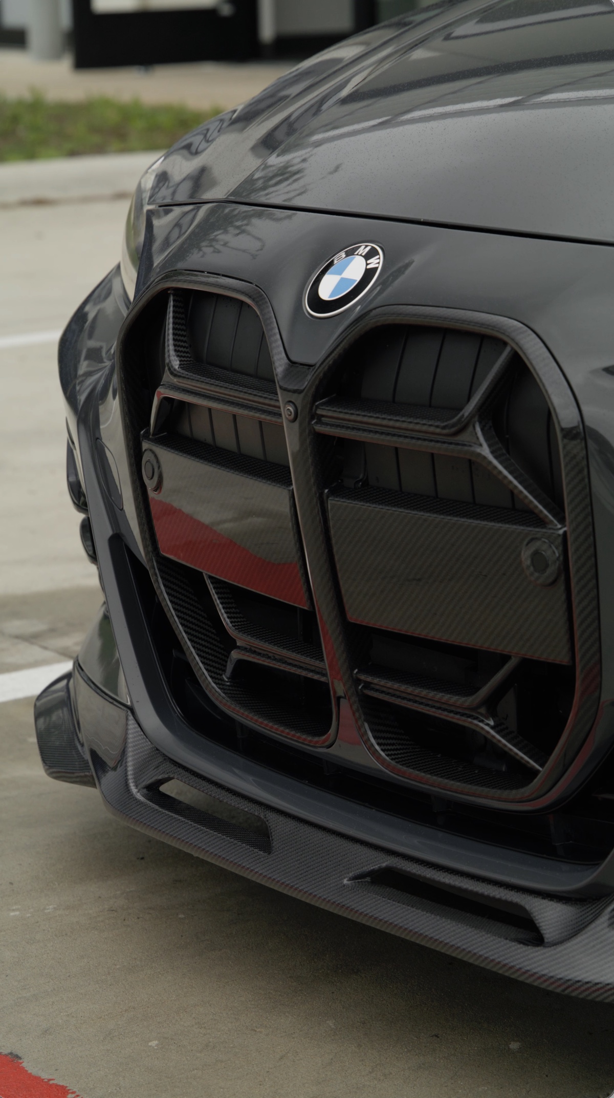 Carbon-fiber grille and front aero installed on a BMW M4 at Red Box Restoration